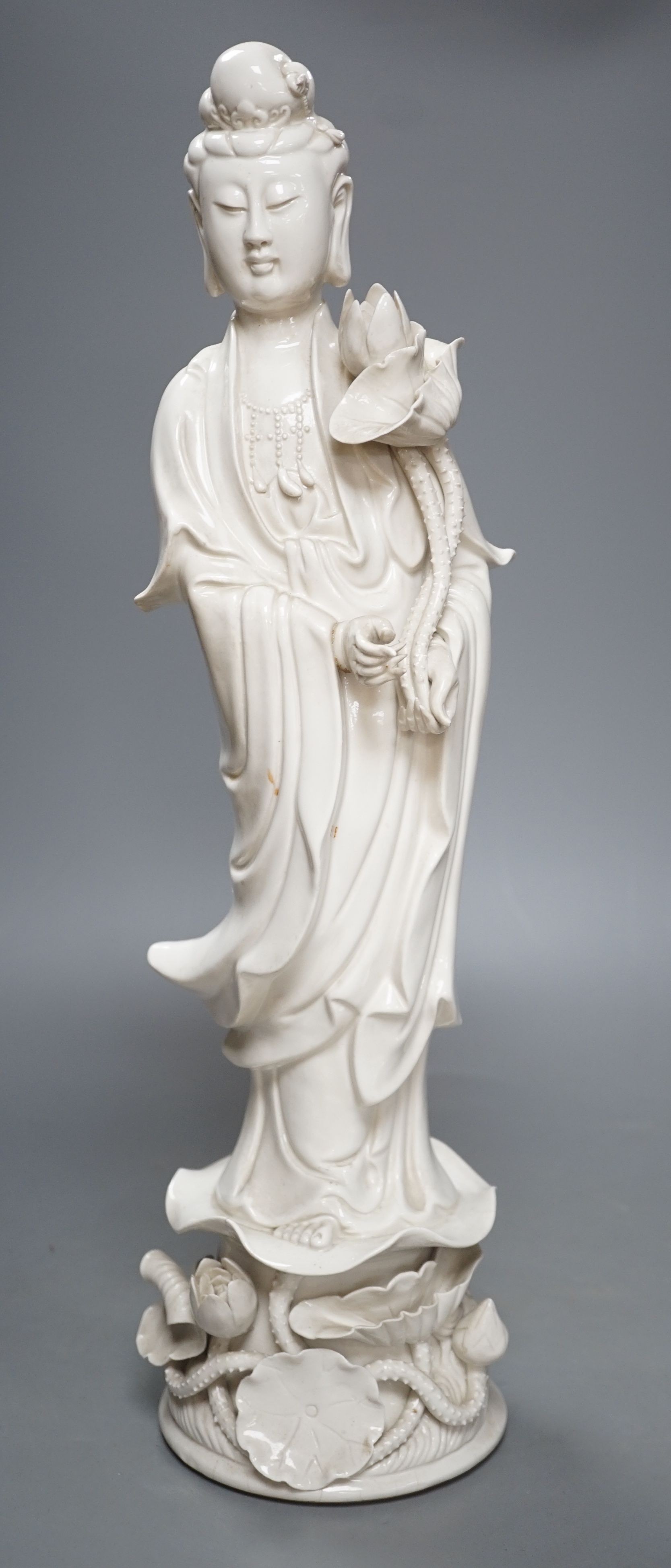 A tall Chinese blanc de chine figure of Guanyin -47cm high